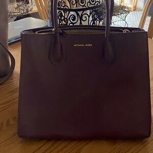 Michael Kors authentic purse . Gently Used (Burgandy). Comes with shoulder strap